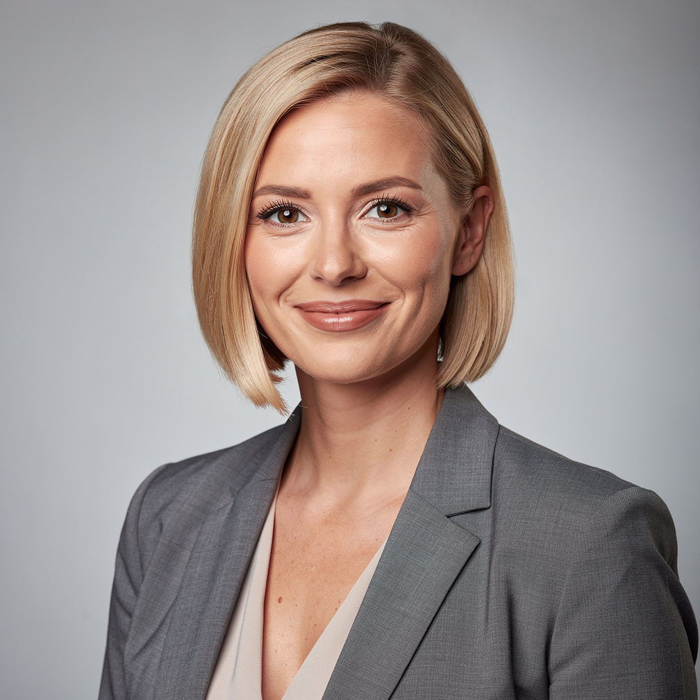 Studio portrait of a Danish woman with short blonde hair smiling